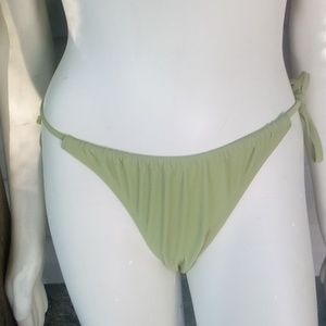 NWOT "Xhileration" green string bikini-bottom only
